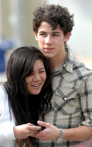 Nick Jonas turned up on Santa Monica beach for an impromptu signing for hundreds of female fans. After just finishing a live guitar session he had all the fans who made the trip, line up for pictures and signings! At one point, nearing the end of the line, he had to take a moment and put his hands on his knees to compose himself before finishing off the job. Nick Jonas, who has been out touring with his own solo project, has reported that the 'Jonas Brothers' band is not breaking up. He was wearing a checked shirt and had a silver purity ring attached to a chain round his neck. <P> Pictured: Nick Jonas <B>Ref: SPL154526  020210  </B><BR/> Picture by: Whittle/Splash News<BR/> </P><P> <B>Splash News and Pictures</B><BR/> Los Angeles:	310-821-2666<BR/> New York:	212-619-2666<BR/> London:	870-934-2666<BR/> photodesk@splashnews.com<BR/> </P>