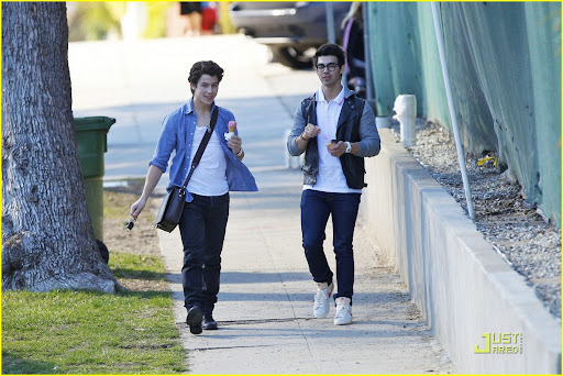 37566, LOS ANGELES, CALIFORNIA - Wednesday February 10, 2010. **EXCLUSIVE** Nick (left) and Joe (right) Jonas share a laugh after getting ice cream together in LA. Joe walked Nick to his truck and gave him a brotherly hug before departing. Joe Jonas, looking fashionable in his two-tone jacket and thick frame glasses, is seen wearing Nike high top sneakers. Nick, on the other hand, kept it more casual in an open button up shirt and shoulder bag worn with dark denim pants and black boots. Photograph: Anthony, PacificCoastNews.com**FEE MUST BE AGREED PRIOR TO USAGE** **E-TABLET/IPAD & MOBILE PHONE APP PUBLISHING REQUIRES ADDITIONAL FEES** UK OFFICE:+44 131 557 7760/7761 US OFFICE:1 310 261 9676
