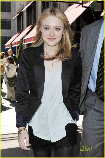 38650, NEW YORK, NEW YORK - Tuesday March 16, 2010. Dakota Fanning stops to pose with her young fans as she steps out of her NYC hotel wearing a lacy skirt with stockings and a black blazer. The 16 year old actress is currently promoting her latest flick "The Runaways" with co-star Kristin Stewart. Photograph: PacificCoastNews.com**FEE MUST BE AGREED PRIOR TO USAGE** **E-TABLET/IPAD & MOBILE PHONE APP PUBLISHING REQUIRES ADDITIONAL FEES** UK OFFICE:+44 131 557 7760/7761 US OFFICE:1 310 261 9676