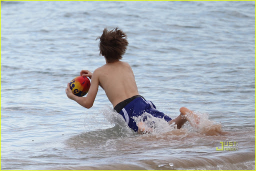 Justin Bieber enjoys an afternoon at Whale Beach in Sydney. The <br />singer decided to dig a big hole in the sand with friends then played <br />some American football. After heating up Justin went for a swim and swam<br /> in the surf, after he got out of the water he posed up with a local <br />girl who was star struck. <P> Pictured: Justin Bieber <br /><B>Ref: SPL174901 240410 </B><BR/> Picture by: <br />Splash News<BR/> </P><P> <B>Splash News and <br />Pictures</B><BR/> Los Angeles:?310-821-2666<BR/> New <br />York:?212-619-2666<BR/> London:?870-934-2666<BR/> <br />photodesk@splashnews.com<BR/> </P>