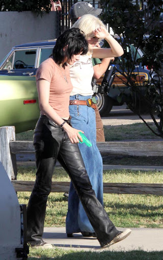 07-22-09 Los Angeles, CAActresses Kristen Stewart and Dakota Fanning on the set of their upcoming movie 'The Runaways' in Los Angeles. In a couple scenes Kristen has a neon green water gun stuffed in the front of her pants...Non-Exclusive Pix by Flynet ©2009818-307-4813  Nicolas310-869-0177  Scott