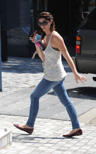 Ashley Greene struggles with her stubborn dog, in Vancouver. The Twilight star was seen walking her dog in downtown Vancouver and seemed to be struggling picking it up as she went about her day. Ashley is in town filming the 3 Twilight film 'Eclipse' <P> Pictured: Ashley Greene <B>Ref: SPL120510 200809 </B><BR/> Picture by: Whittle/Beetham / Splash News<BR/> </P><P> <B>Splash News and Pictures</B><BR/> Los Angeles: 310-821-2666<BR/> New York: 212-619-2666<BR/> London: 870-934-2666<BR/> photodesk@splashnews.com<BR/> </P>