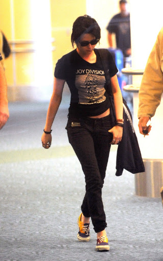 Kristen Stewart punches the air as she arrives back in Vancouver for Twilight. The Twilight star who plays Bella Swan in the hit series arrived back after catching an early flight from LA. Kristen who was at the Teen Choice Awards arrived back for the third installment 'Eclipse' <P> Pictured: Kristen Stewart <B>Ref: SPL118680 100809 </B><BR/> Picture by: Whittle/Beetham /Randy/ Splash<BR/> </P><P> <B>Splash News and Pictures</B><BR/> Los Angeles: 310-821-2666<BR/> New York: 212-619-2666<BR/> London: 870-934-2666<BR/> photodesk@splashnews.com<BR/> </P>