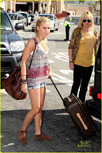35057, LOS ANGELES, CALIFORNIA - Wednesday October 21, 2009.**EXCLUSIVE** Ashley Tisdale is spotted being dropped off at the Burbank Airport by her Mother. Ashley is off to Arizona to perform a concert over the weekend. She wore short jean shorts, leather moccasins and pulled a Louis Vuitton suitcase. Photograph: Matt Symons, PacificCoastNews.com ***FEE MUST BE AGREED PRIOR TO USAGE*** UK OFFICE: +44 131 557 7760/7761/7762 US OFFICE: 1 310 261 9676