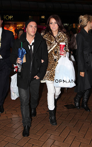 Miley Cyrus leaves the Starbucks in Blackpool, UK, where she will perform tonight for the Queen of England. <P> Pictured: Miley Cyrus <B>Ref: SPL144126 071209 </B><BR/> Picture by: Pete Goddard / Splash News<BR/> </P><P> <B>Splash News and Pictures</B><BR/> Los Angeles: 310-821-2666<BR/> New York: 212-619-2666<BR/> London: 870-934-2666<BR/> photodesk@splashnews.com<BR/> </P>