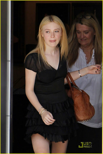 41808, NORTH HOLLYWOOD, CALIFORNIA - Monday June 21, 2010. **EXCLUSIVE** Dakota Fanning, one of the stars of the upcoming "Twilight Saga: Eclipse" seen leaving a photoshoot in North Hollywood wearing a black dress and flip flops. Photograph: Juan Sharma, PacificCoastNews.com**FEE MUST BE AGREED PRIOR TO USAGE** **E-TABLET/IPAD & MOBILE PHONE APP PUBLISHING REQUIRES ADDITIONAL FEES** UK OFFICE:+44 131 557 7760/7761 US OFFICE:1 310 261 9676