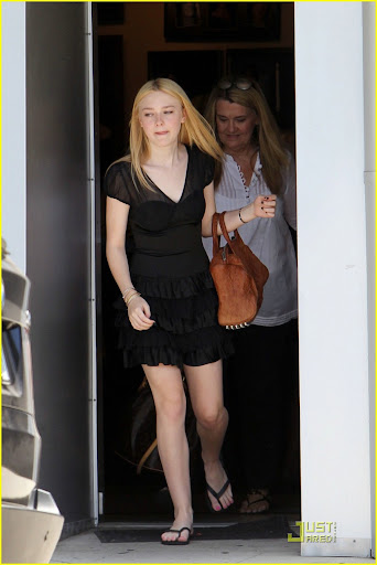 41808, NORTH HOLLYWOOD, CALIFORNIA - Monday June 21, 2010. **EXCLUSIVE** Dakota Fanning, one of the stars of the upcoming "Twilight Saga: Eclipse" seen leaving a photoshoot in North Hollywood wearing a black dress and flip flops. Photograph: Juan Sharma, PacificCoastNews.com**FEE MUST BE AGREED PRIOR TO USAGE** **E-TABLET/IPAD & MOBILE PHONE APP PUBLISHING REQUIRES ADDITIONAL FEES** UK OFFICE:+44 131 557 7760/7761 US OFFICE:1 310 261 9676