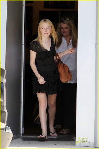 41808, NORTH HOLLYWOOD, CALIFORNIA - Monday June 21, 2010. **EXCLUSIVE** Dakota Fanning, one of the stars of the upcoming "Twilight Saga: Eclipse" seen leaving a photoshoot in North Hollywood wearing a black dress and flip flops. Photograph: Juan Sharma, PacificCoastNews.com**FEE MUST BE AGREED PRIOR TO USAGE** **E-TABLET/IPAD & MOBILE PHONE APP PUBLISHING REQUIRES ADDITIONAL FEES** UK OFFICE:+44 131 557 7760/7761 US OFFICE:1 310 261 9676