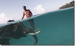Nazroo, a mahout (elephant driver), poses for a portrait while taking his elephant, Rajan, out for a swim in front of Radha Nagar Beach in Havelock, Andaman Islands. Rajan is one of the few elephants in Havelock that can swim, so when he is not dragging timber in the forest he is used as a tourist attraction. The relationship between the mahout and his elephant usually lasts for their entire lives, creating an extremely strong tie between the animal and the human being. (Photo and caption by Cesare Naldi) Nazroo, a mahout (elephant driver), poses for a portrait while taking his elephant, Rajan, out for a swim in front of Radha Nagar Beach in Havelock, Andaman Islands. Rajan is one of the few elephants in Havelock that can swim, so when he is not dragging timber in the forest he is used as a tourist attraction. The relationship between the mahout and his elephant usually lasts for their entire lives, creating an extremely strong tie between the animal and the human being. (Photo and caption by Cesare Naldi)