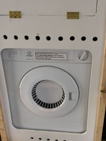 Tumble drier for soggy undersuits and towels.
