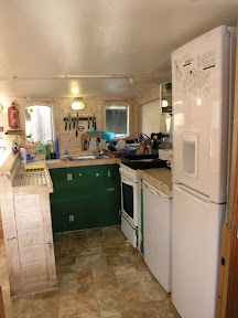Galley on a typical day. Two fridges, freezer, microwave, slow cooker and normal cooker.