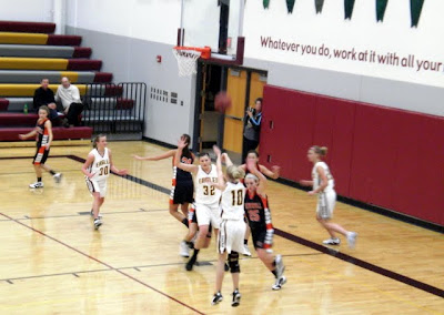 Pella Christian's Jasmin Schelhaas (10) releases a jump shot