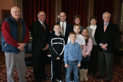 Pictured from Left to Right: (Back row) Don Piersma, Rep. Jim Van Engelenhoven, Rev. Chris Piersma, Cindy Piersma, Jan Piersma and Sen. Paul McKinley. (Front Row): Caleb Piersma, Isaac Piersma, Josh Piersma and Rebecca Piersma. Photo courtesy Sen. Paul McKinley.