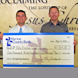 Pella Christian Grade School Principal David De Jong and Ron Zantingh of Marion County Bank