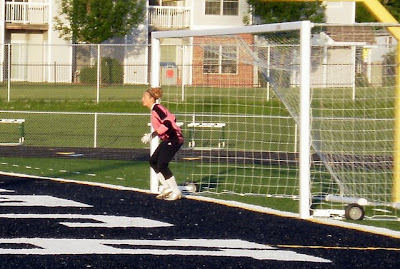Pella's Kelsey Fynaardt prepares to defend against a free kick
