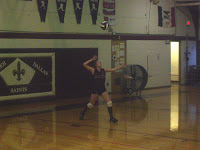 Melcher-Dallas' Mallie Wells prepares to serve.