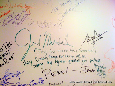 Joel McHale's signature on Conan's wall