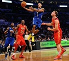 LOS ANGELES, CA - FEBRUARY 20:  Derrick Rose #1 of the Chicago Bulls and the Eastern Conference goes up for a layup between Kevin Durant #35 of the Oklahoma City Thunder and the Western Conference and Blake Griffin #32 of the Los Angeles Clippers and the Western Conference in the 2011 NBA All-Star Game at Staples Center on February 20, 2011 in Los Angeles, California. NOTE TO USER: User expressly acknowledges and agrees that, by downloading and or using this photograph, User is consenting to the terms and conditions of the Getty Images License Agreement.  (Photo by Kevork Djansezian/Getty Images)