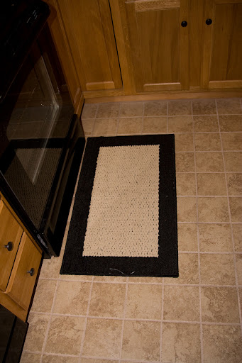 One throw rug for in front of the stove
