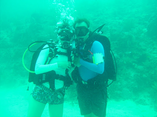 Ana and me in front of the reef near the sandy bottom of the ocean.