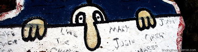[Manpeeringoverawallrockart7.jpg]