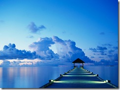 A dock at sunset on White Sands Island in the Maldives.