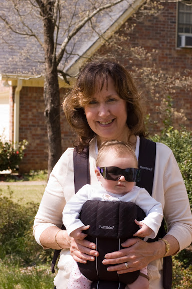 Honey walking Sam in the baby bjorn.  We dig the Stevie Wonder look...