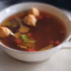 Tomato and Celery-Infused Beef Consommé with Tiny Choux Puffs