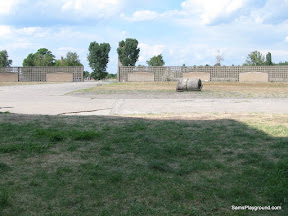 Roll Call Area with fence showing Barrack locations.JPG
