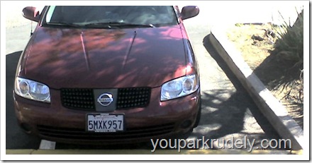 Red Nissan parked rudely - youparkrudely.com