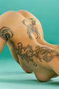 Tangent shows off her tattoos