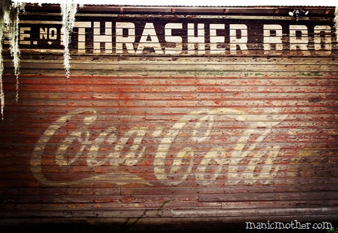 painted coca cola on barn