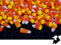 Brightly Coloured candy corn accidentally spilled on a black piece of posterboard that looked better on the posterboard than in the candy dish the original still-life photograph was being taken for. Halloween Candy! Brightly Coloured candy corn accidentally spilled on a black piece of posterboard that looked better on the posterboard than in the candy dish the original still-life photograph was being taken for. Halloween Candy!