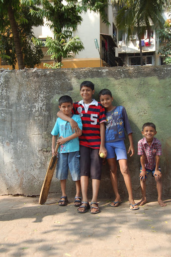 Children playing Cricket In the Street in Mumbai