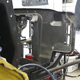 Panel mostly removed, looking from the right side of the car towards the front.