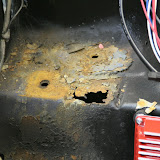 I removed the battery tray, and found yet another rusted throug spot! The only way to properly repair this is to remove the whole panel and replace it. Luckily, these panels are easily obtained.