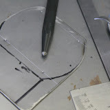 I drew out the pattern, marked the line for the screw holes, and hit the hole locations with a center punch before drilling. the center punch makes drilling so much easier - the bit won