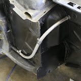 This is covered with heat shrink tubing to protect it from debris, and to keep it from rubbing through the rubber grommets where it passes through metal.