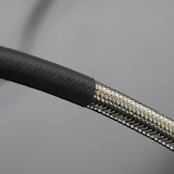 heat shrink tubing prevents it from abrating against anything - this hose will cut through other metal over time