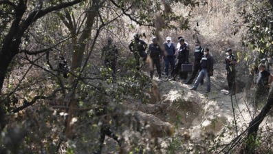 [State police guard the site where at least five bodies were found in a clandestine grave in Santa Mara Tlalmanalco on the outskirts of Mexico City[3].jpg]