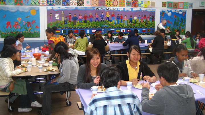 Students of diverse cultural backgrounds enjoy Thanksgiving together after intense learning. For some, this is their first Thanksgiving.
