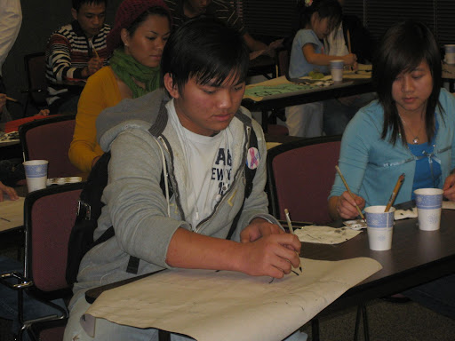 Students learn calligraphy