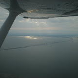 The sunlight from the water reflected on the wing... The sunlight from the water reflected on the wing...