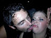 Trying to lick her face - He's in love. She isn't.