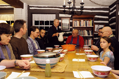 The Sangha being served soba noodles by the resident priests