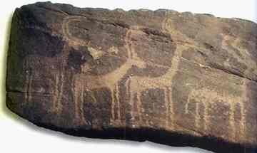 A sandstone rock representing four gazelles 