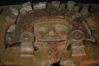 A detail of a massive stone sculpture of the Aztec goddess Tlaltecuhtli is displayed for the first time prior to the opening of the exposition "Moctezuma II, Times and Destiny of a Ruler" at Mexico City's Templo Mayor museum Wednesday, June 16 2010. The largest Aztec stone sculpture ever found with its original coloring, the deity sat atop a Mexico City site where archaeologists believe the ashes of Aztec rulers were buried. Although no burial site has been found, offerings have been found nearby since 2007 and now archaeologists plan to dig a lateral tunnel in hopes of finding the tombs they still believe are nearby.