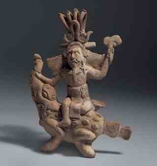 he Jaguar God of the Underworld rides a crocodile. He is the nocturnal aspect of the Sun God and may also have been the ancient Maya God of Fire.