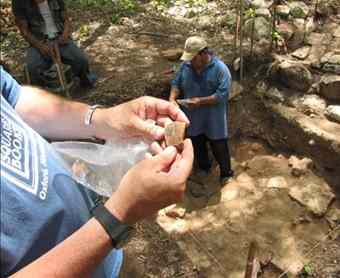 Archaeologist George Bey examines a shard of pottery found buried in the floor of a home at Kiuic. Archaeologist George Bey examines a shard of pottery found buried in the floor of a home at Kiuic.