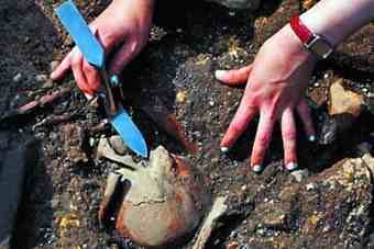 The Abbey dig team excavates a human skeleton The Abbey dig team excavates a human skeleton